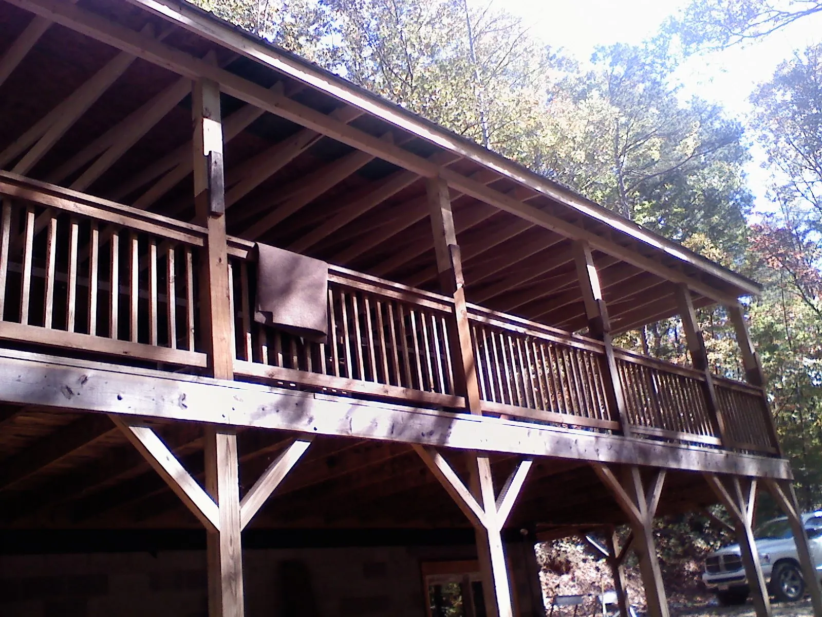 Timber framing under a new elevated porch and deck — Roof Leak Repair in Boothbay Harbor by Roofing Brothers
